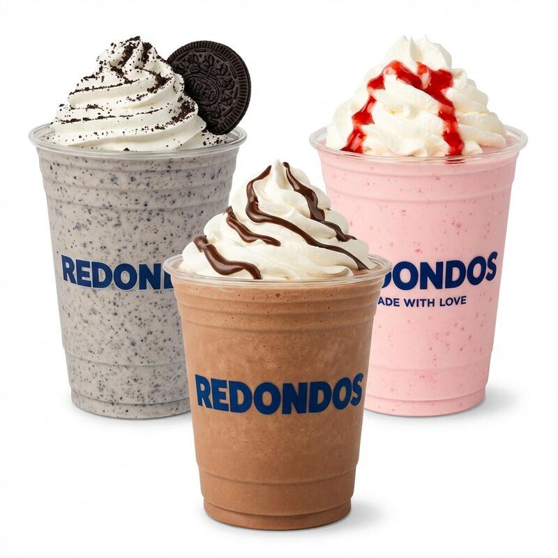 Three Redondos branded milkshakes — Oreo cookies and cream Nutella chocolate and strawberry with whipped cream in REDONDOS cups