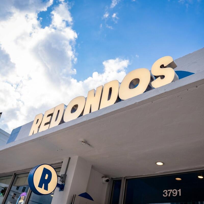 Redondos restaurant exterior at 3791 Bird Road Miami with illuminated REDONDOS sign and address number