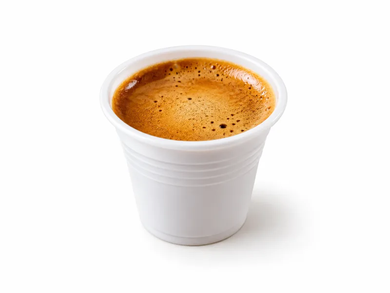 Cuban colada coffee in a small white cup at Redondos Miami