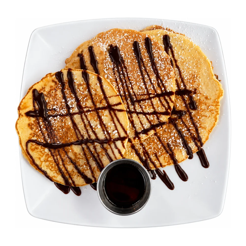 Three pancakes with chocolate sauce and syrup at Redondos Miami on Bird Road